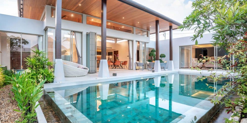 Home showing tropical pool villa with green garden and bedroom