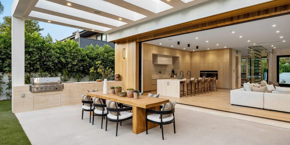 Upscale modern living room with fireplace and neutral gray and cream walls and furniture