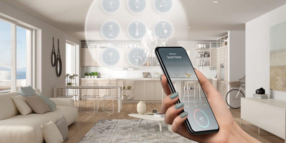 Smart home technology, woman's hand holding remote control
