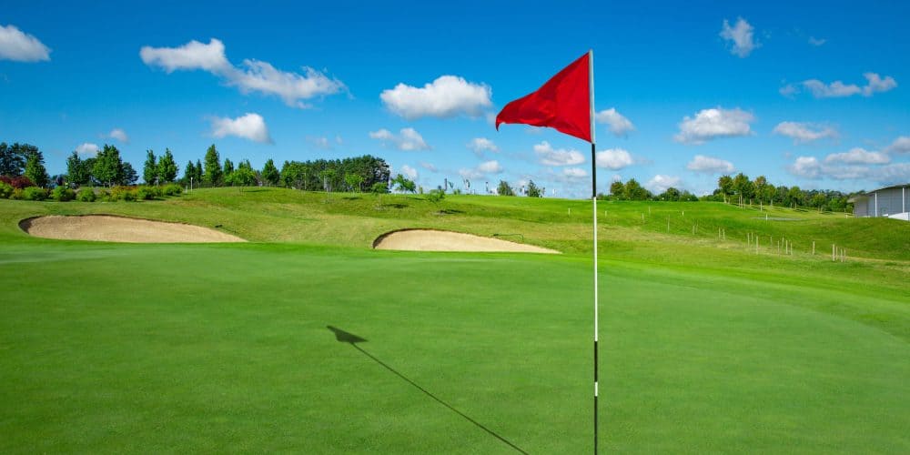  close up of Golf course and the red flag