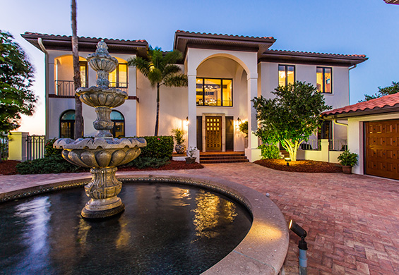This waterfront home for sale in Venice, FL Palazzo Laguna, demonstrates dazzling Mediterranean architecture and a grand fountain reminiscent of the fountains of Venice.
