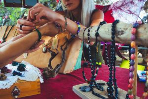 Wood beaded jewelry displayed at craft fair