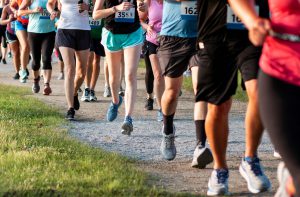 image from waist down of people running