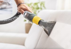 close up of white sofa cushion being steamed clean