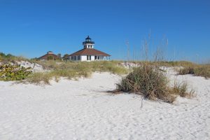View of beach and building in background on Boca Grande