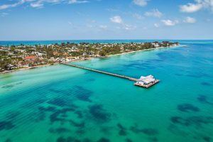Aerial view of Anna Maria coastline with pier in turquoise waters