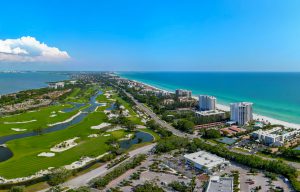 Aerial view of Longboat Key showing coastline, buildings and golf course