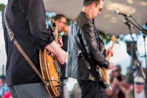 Musicians playing guitars on stage