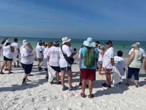 Michael Saunders agents and Special Olympic Athletes volunteer to do beach clean up