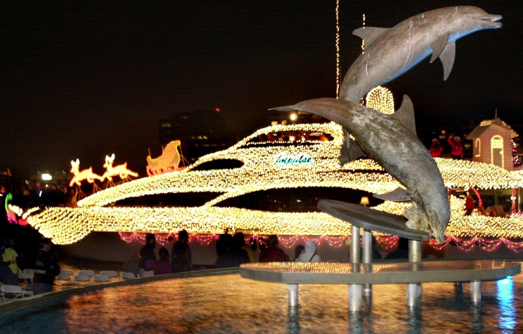 LEDE PHOTO PLEASE 12/14/02---(Photo by Nicole Fruge', digital image) A 106 foot motor yacht named Impulse passes by the dolphin sculpture at Bayfront Park during the 18th annual Boat Parade of Lights Saturday night. The boat, operated by Roy Hodges of Longboat Key, won first place in the 31 feet and over category. For more parade results click www.sarasotaparade.com. SNN will rebroadcast the parade at 8 pm Monday.