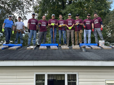 Day of Service roofing crew partnered with Good Neighbors