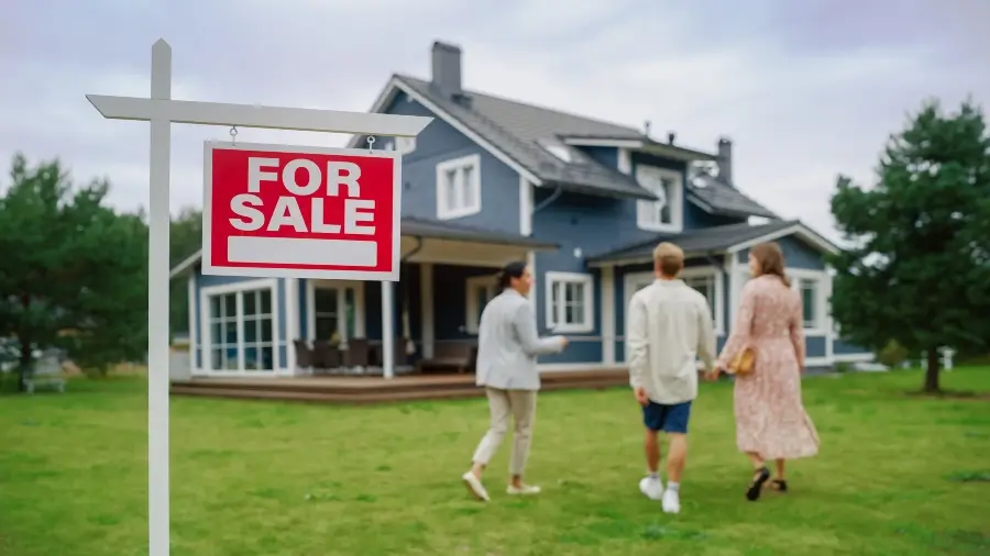 Realtor Meeting a Beautiful Successful Couple in Front of a Modern Big House That is For Sale.