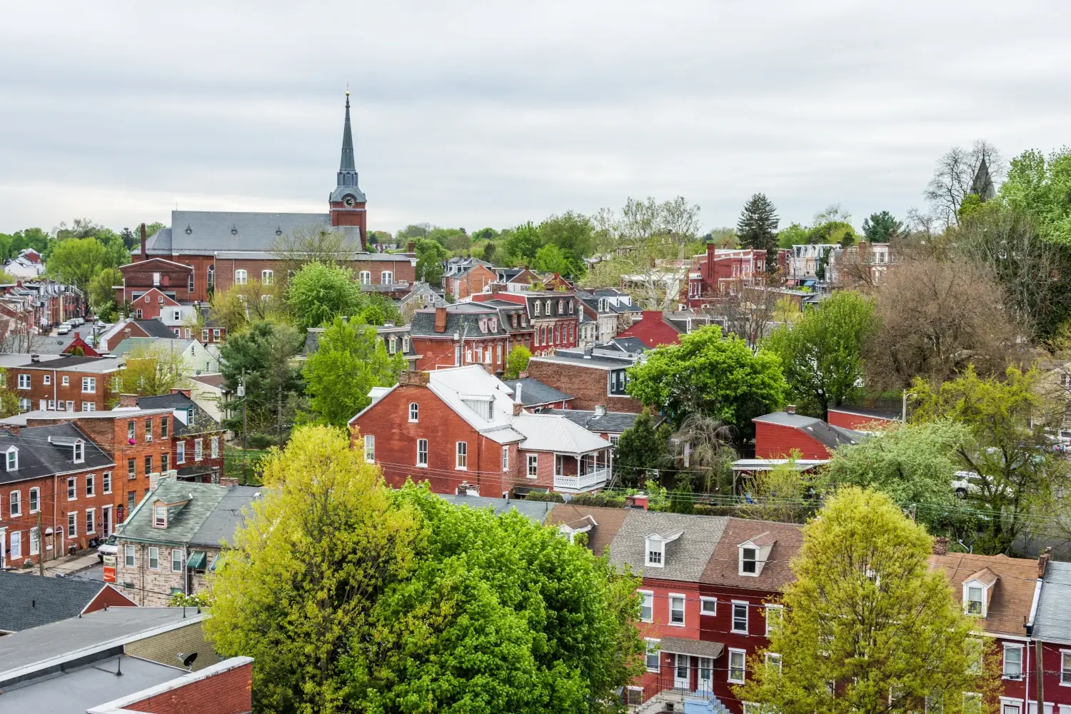 Aerial of historic downtown Lancaster, Pennsylvania with blooming trees