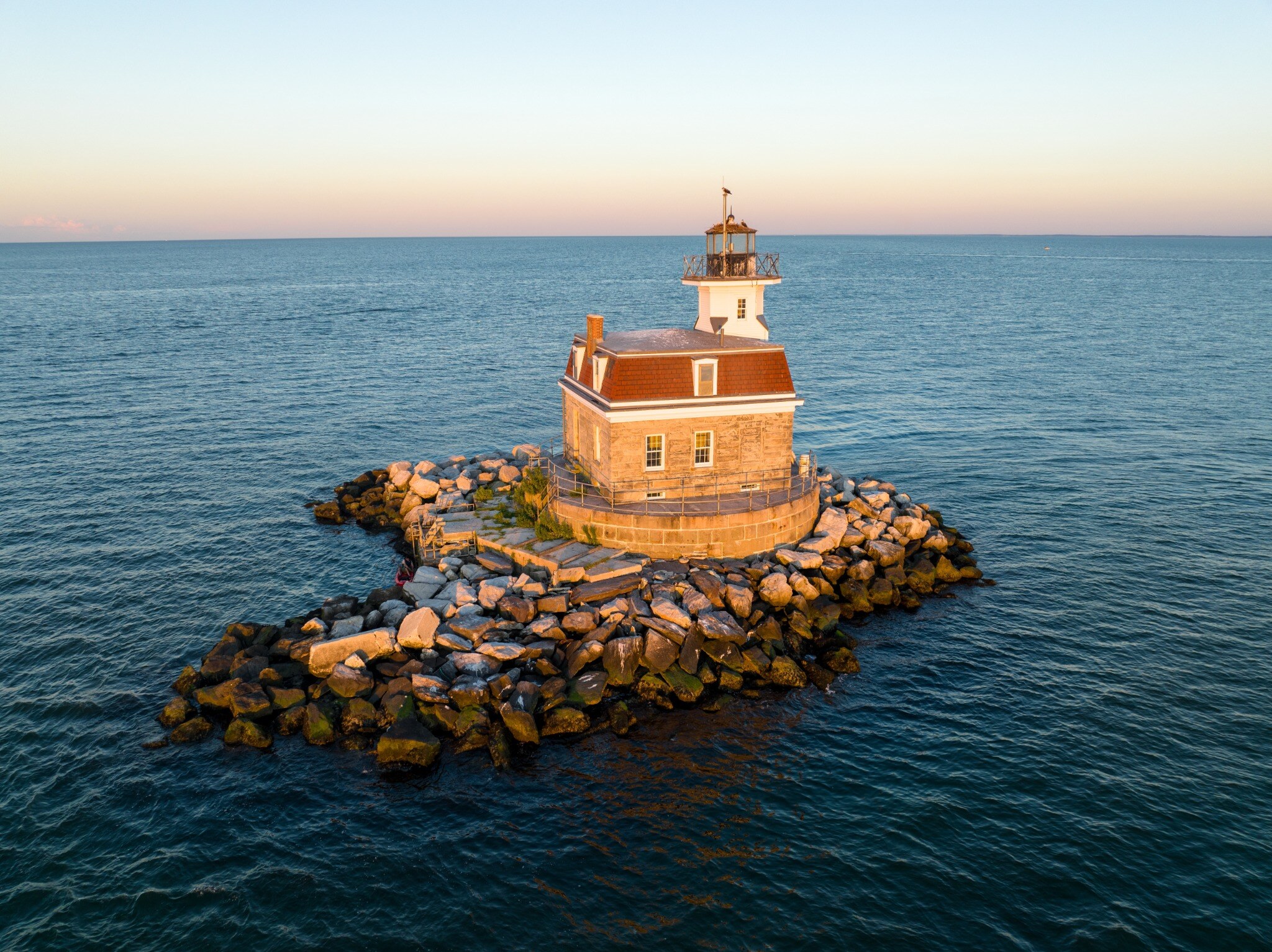 Penfield Reef Lighthouse at sunset, offshore from Fairfield, CT