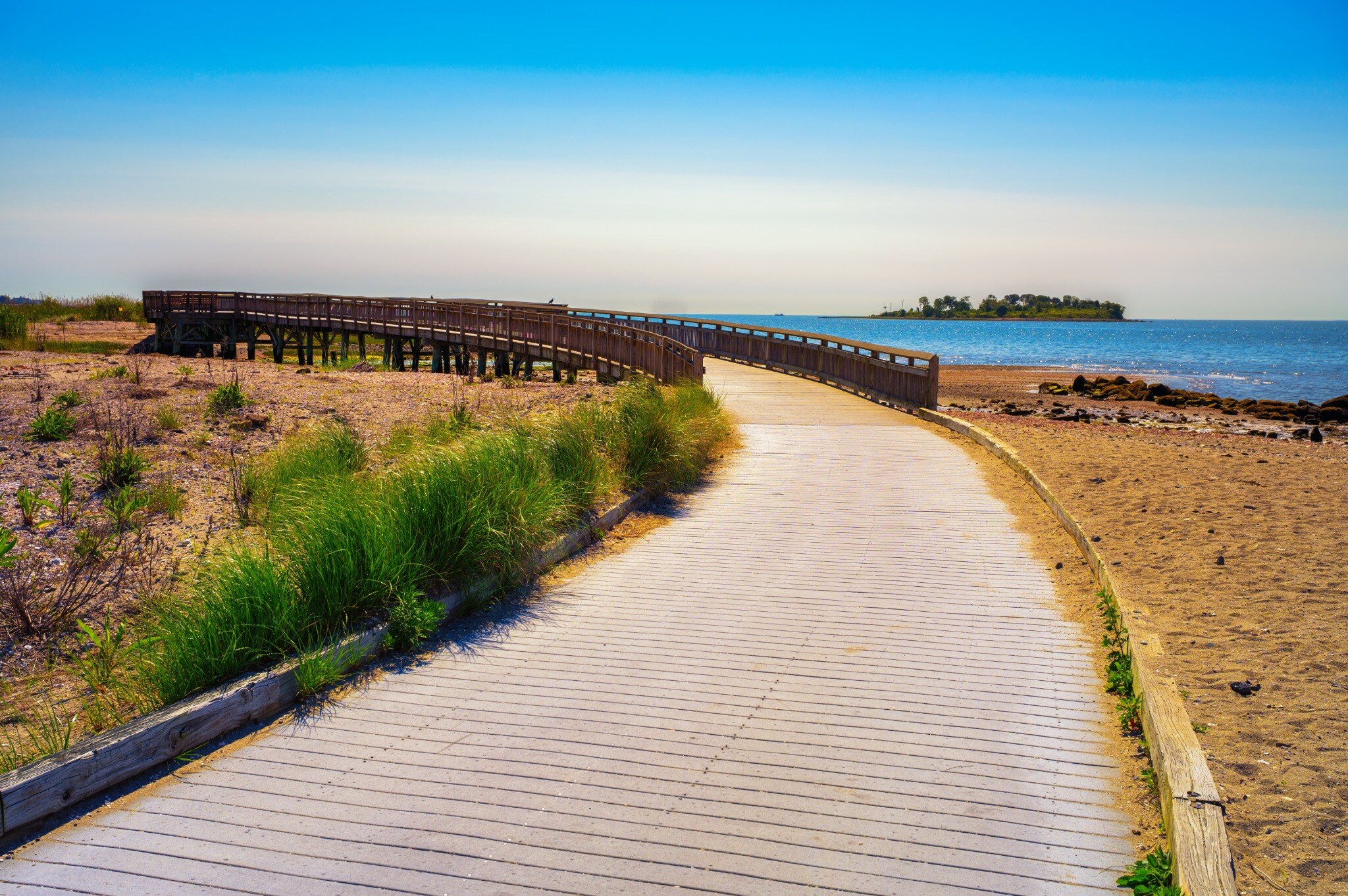 The boardwalk at Silver Sands State Park in Milford, CT, looking out toward Charles Island