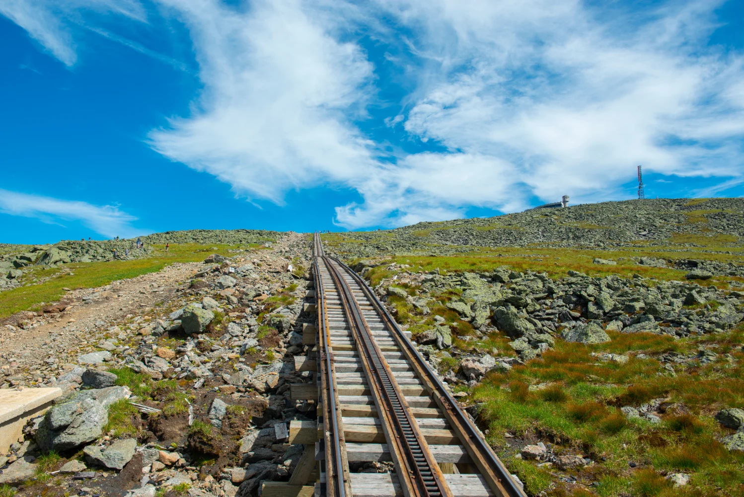 Mount Washington in summer with antique cog train track. Viewed from cog train on Mount Washington in White Mountain, New Hampshire NH, USA
