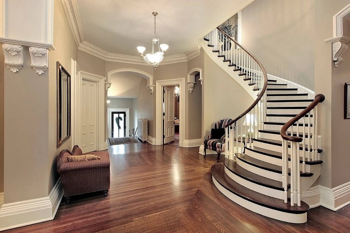 Elegant entryway with staircase, high ceiling, modern finish
