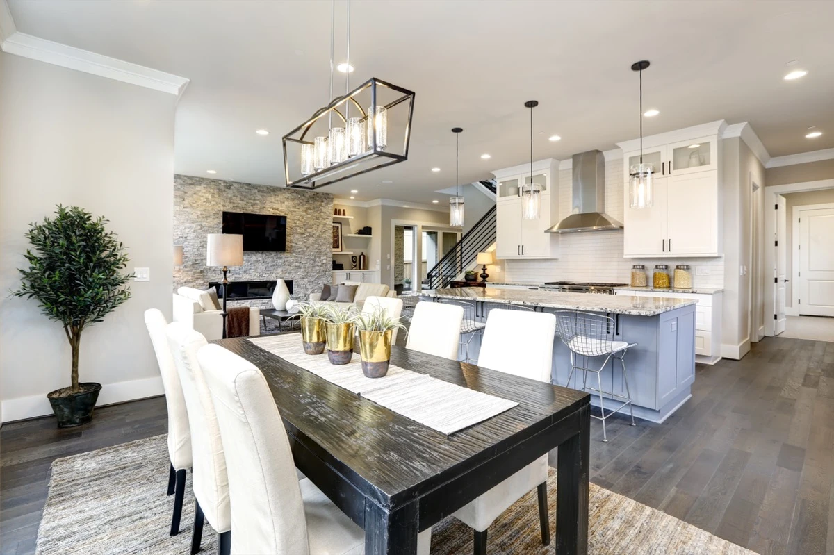 Modern kitchen with large island, stainless appliances, bright