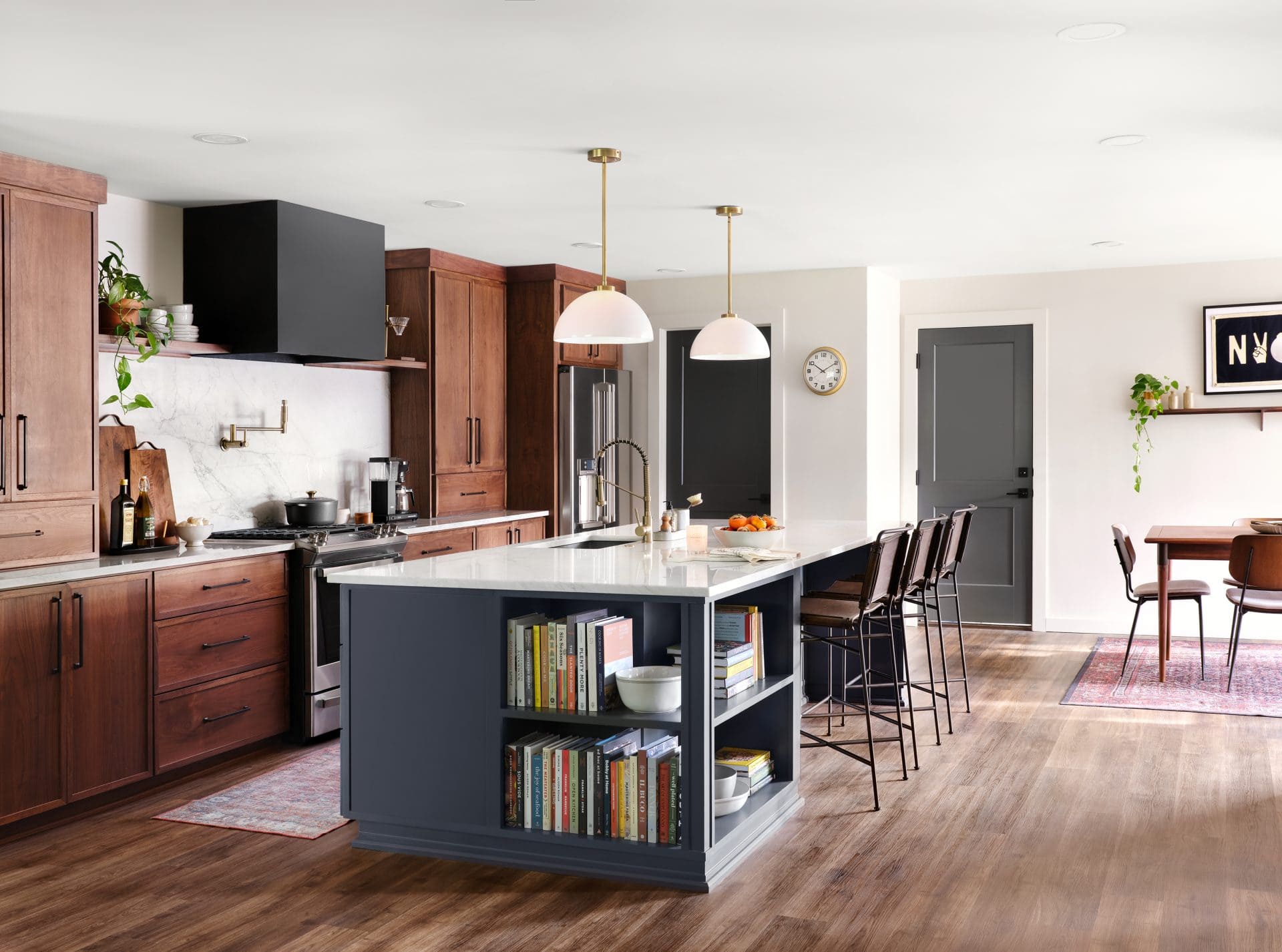 Asymmetrical island with open shelving in a modern kitchen