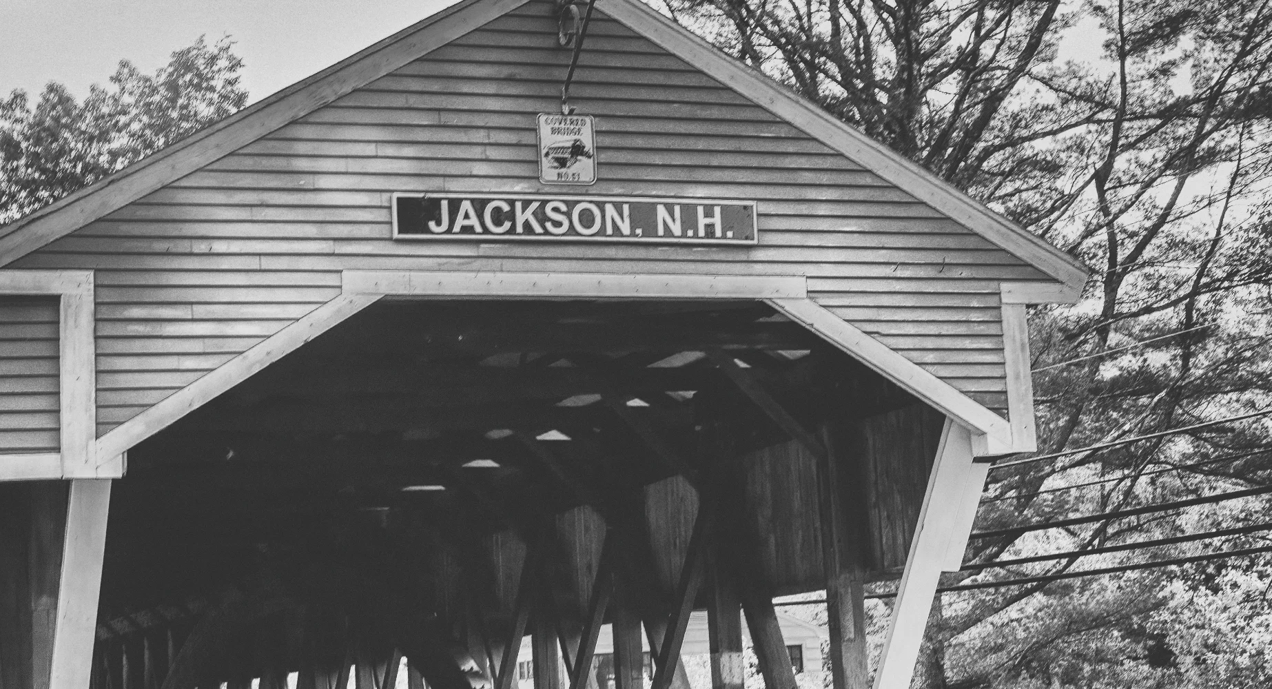 JACKSON, NH - OCTOBER 2015: Wooden covered bridge in Jackson, foliage season.