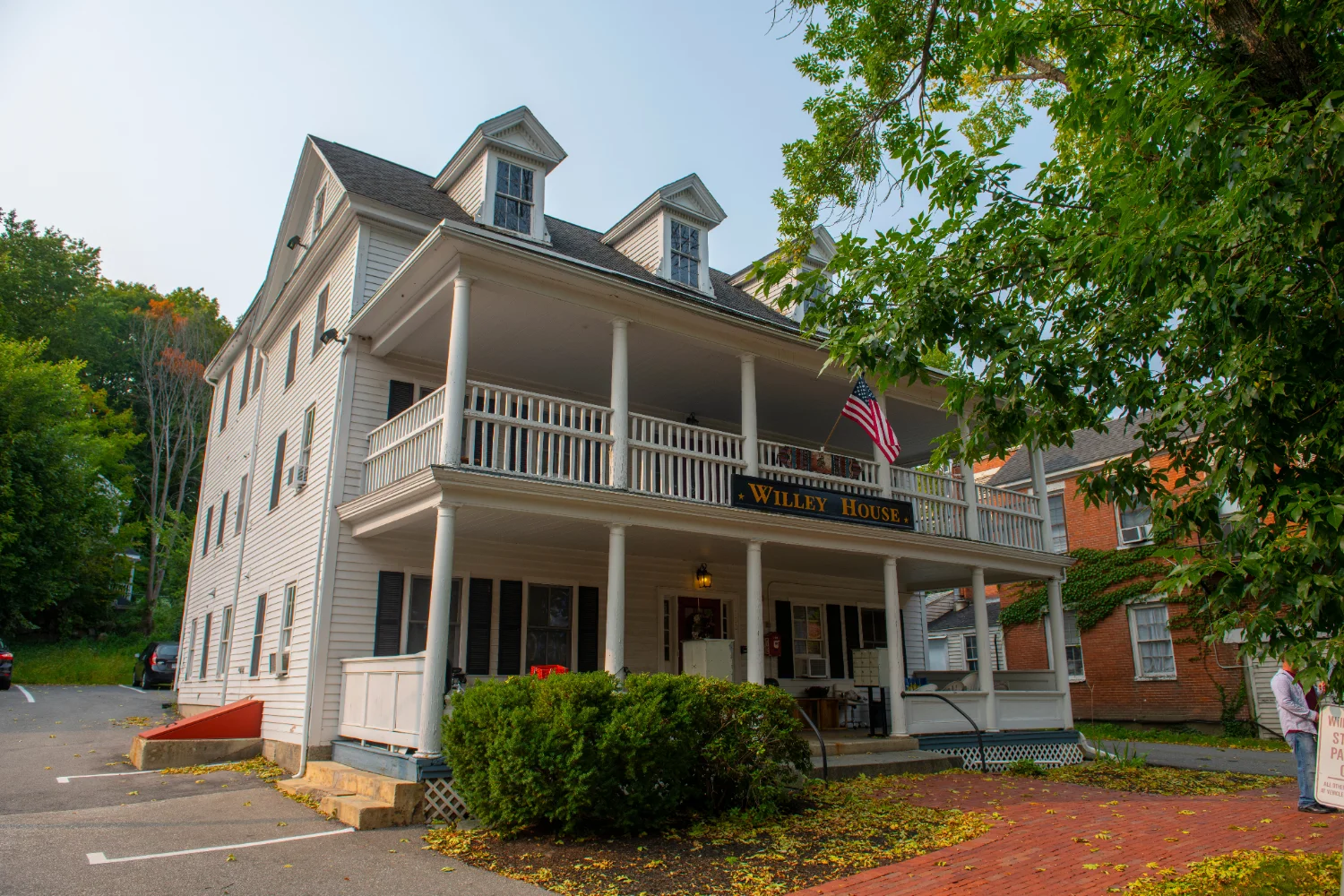 The historic Willey House, a white clapboard building with a two-story covered porch