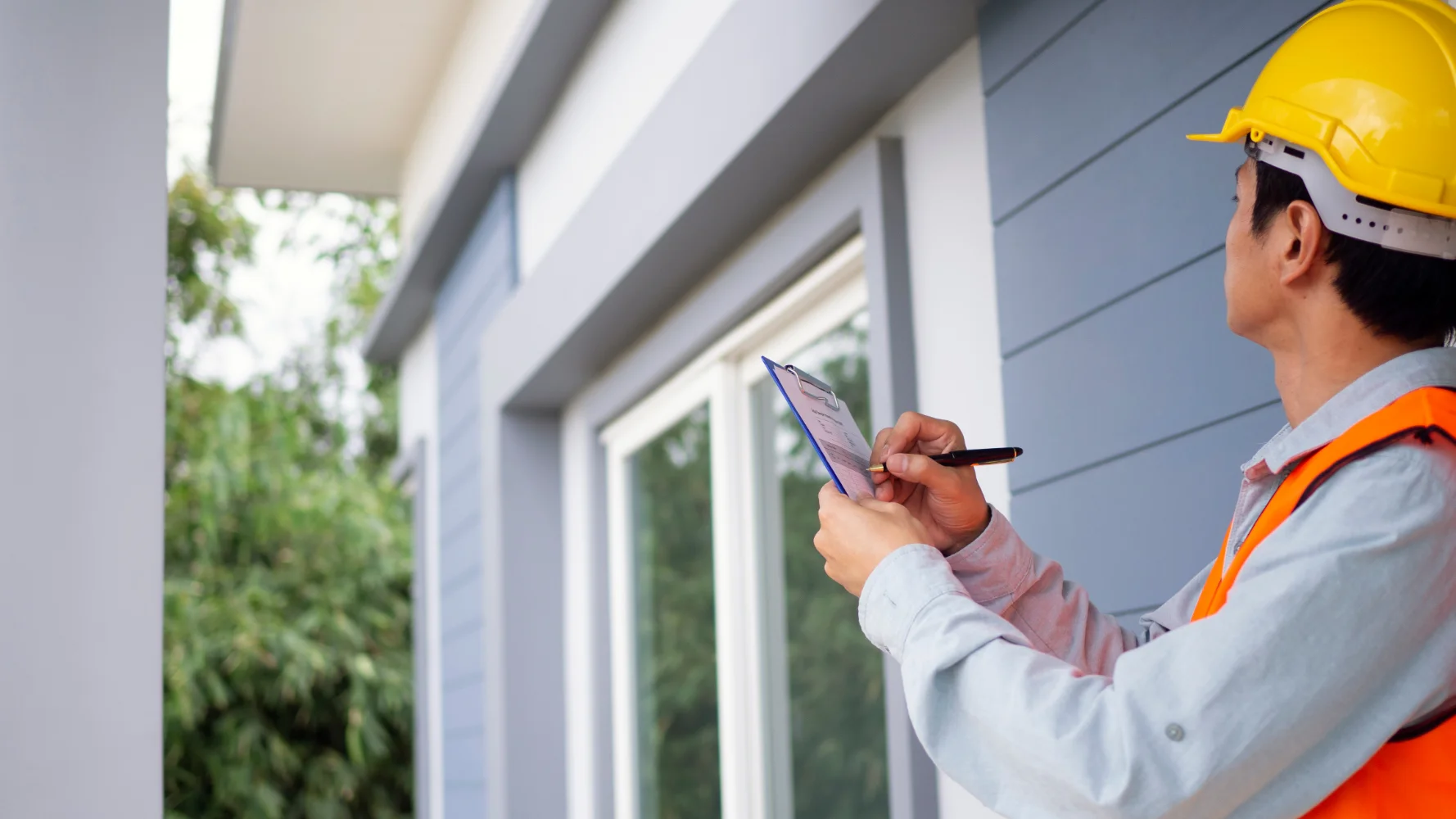 Real estate agent and buyers conducting a final walk-through inspection of a home