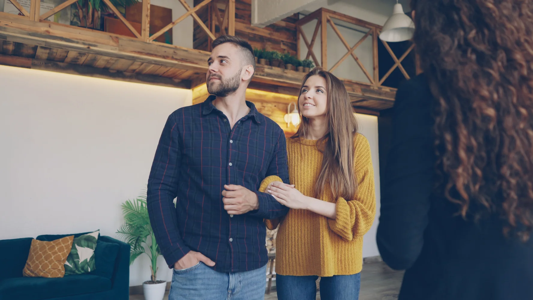 Homebuyers shaking hands with their North Shore real estate agent