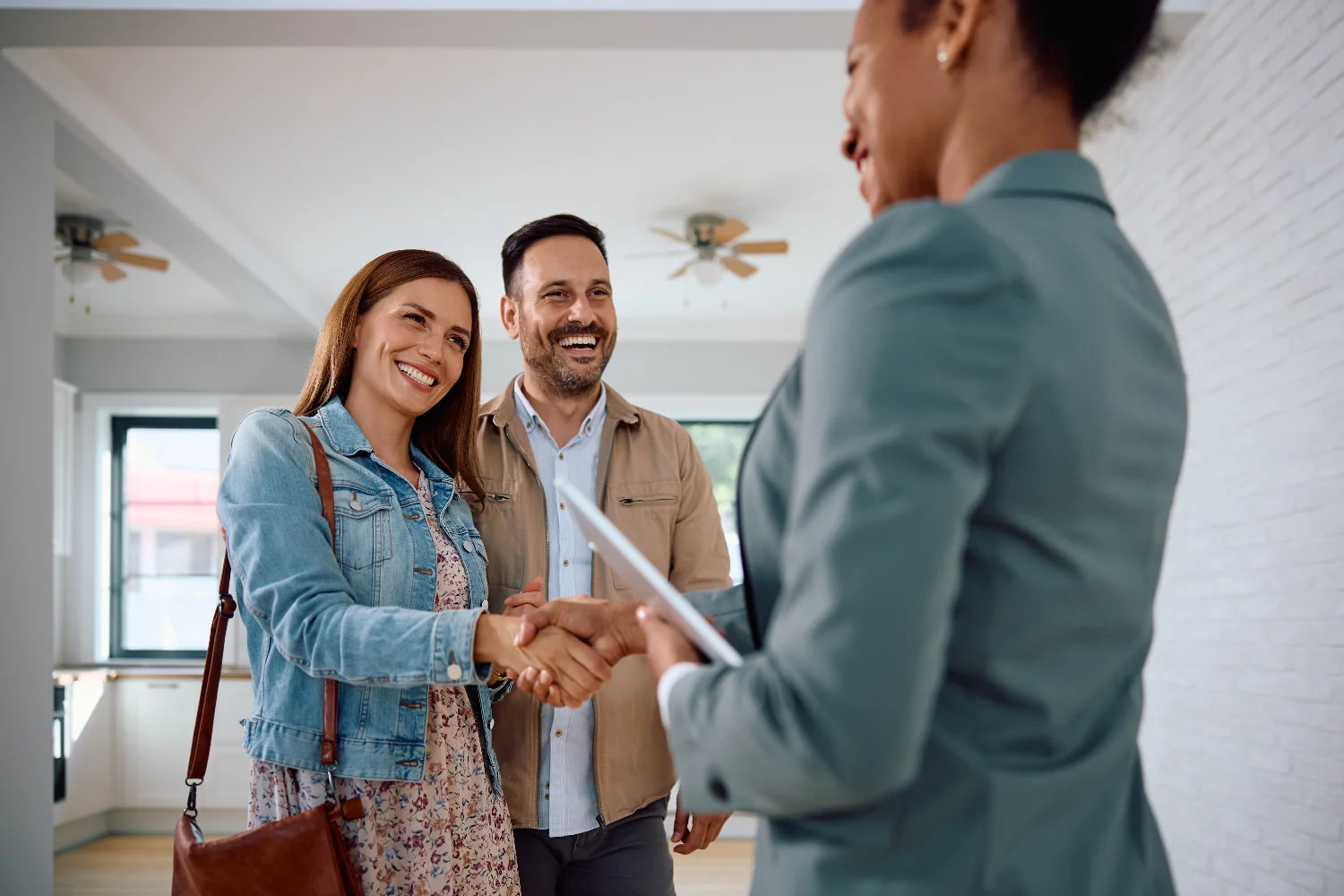 Real estate agent consulting with clients