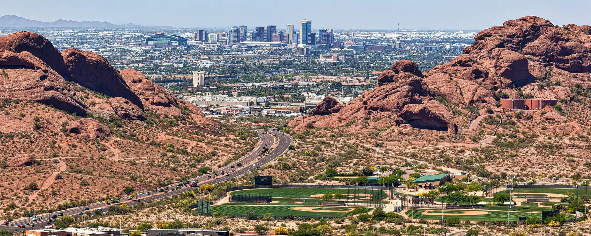 Downtown Phoenix seen from between the Papago Buttes