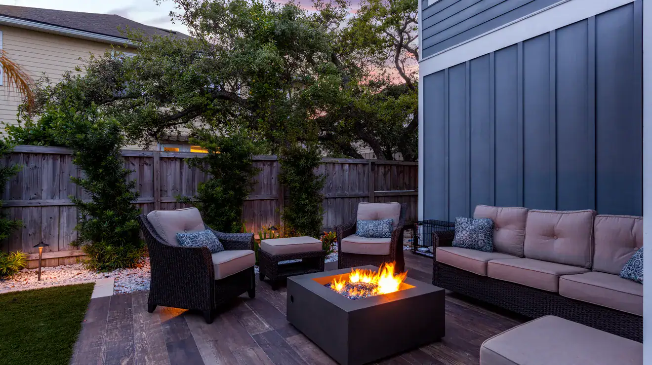 Backyard fire pit at dusk