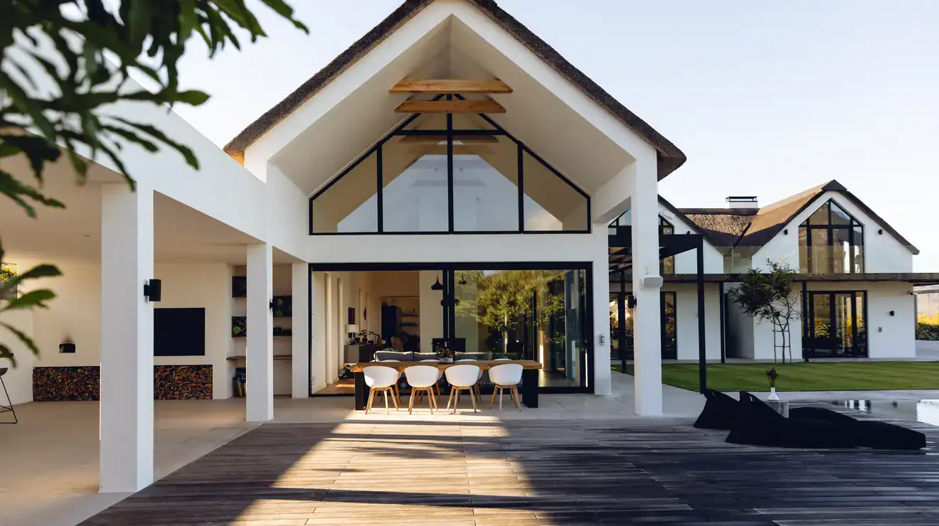Modern house exterior with an outdoor dining area