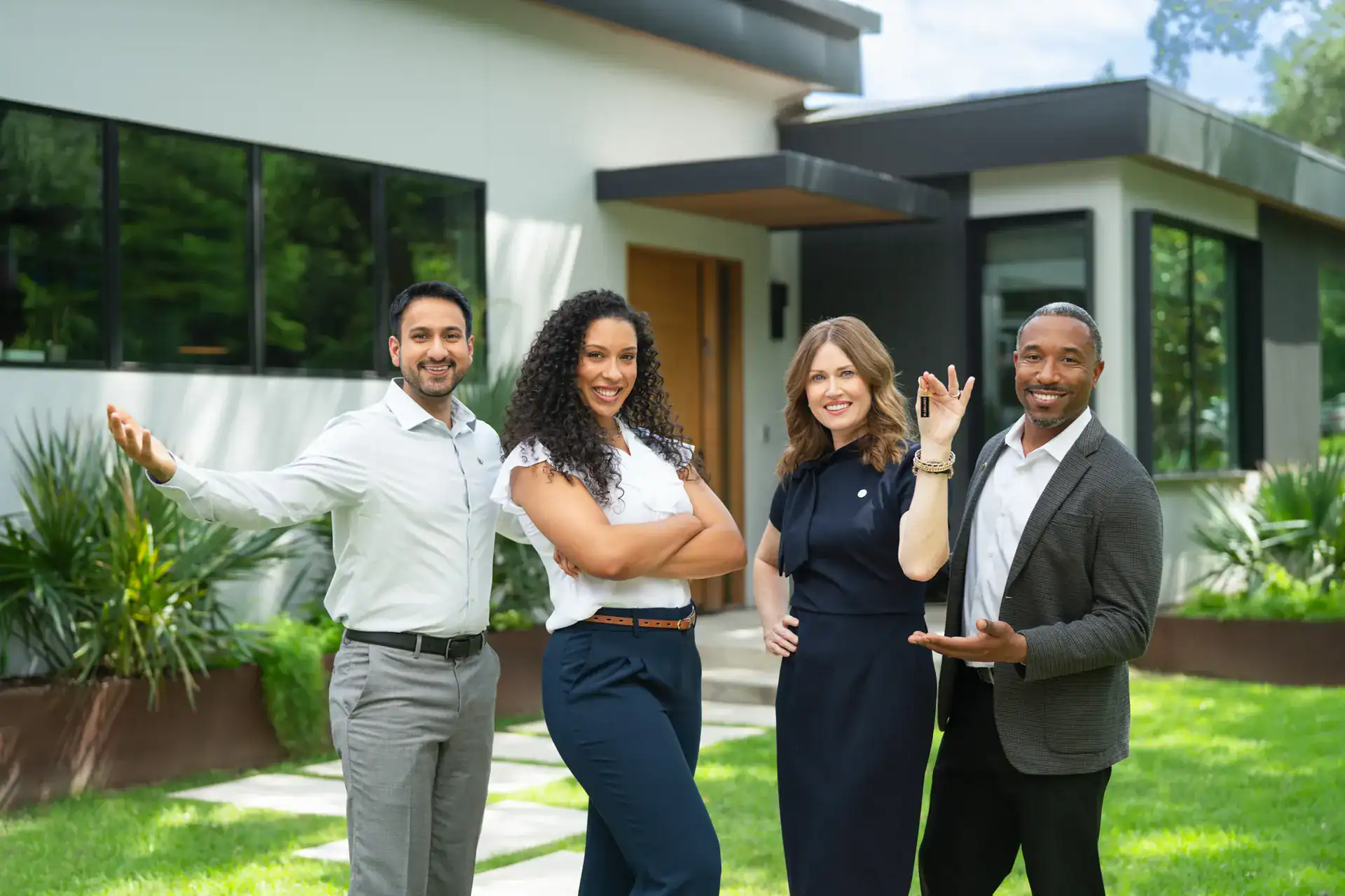 Century 21 agents waving outside a modern home