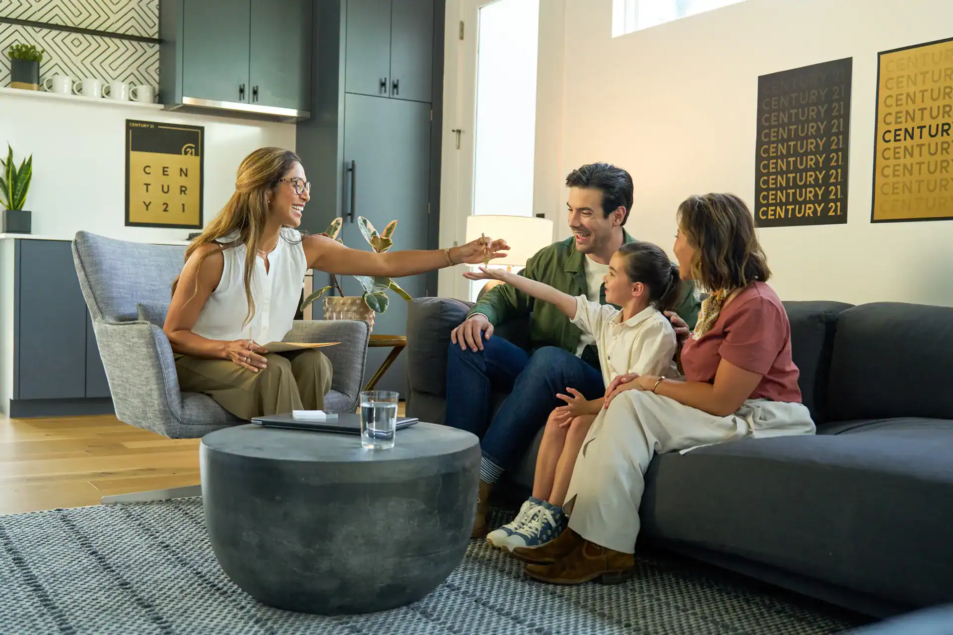 Century 21 agent meeting with a family in their living room