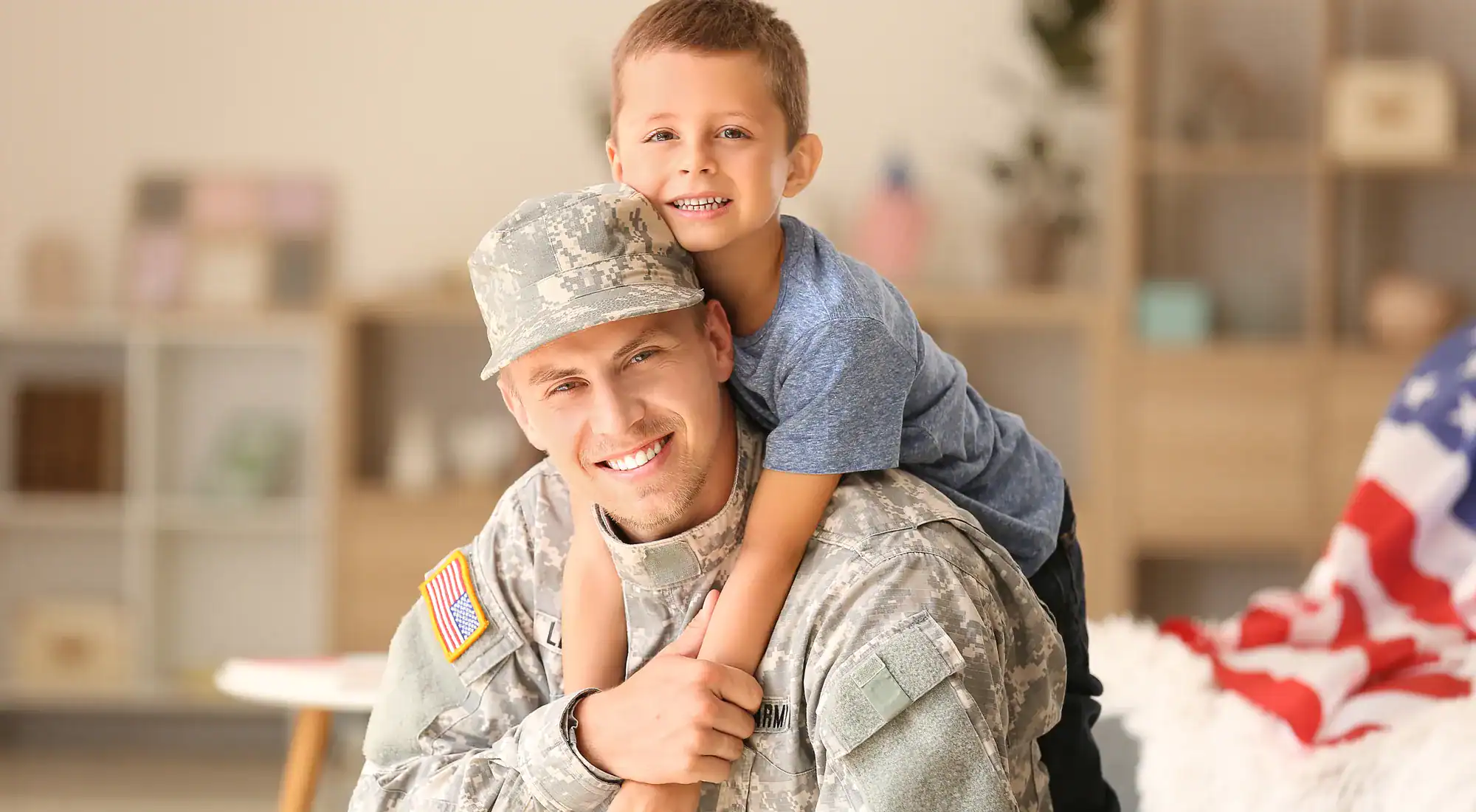 Service member at home with his son