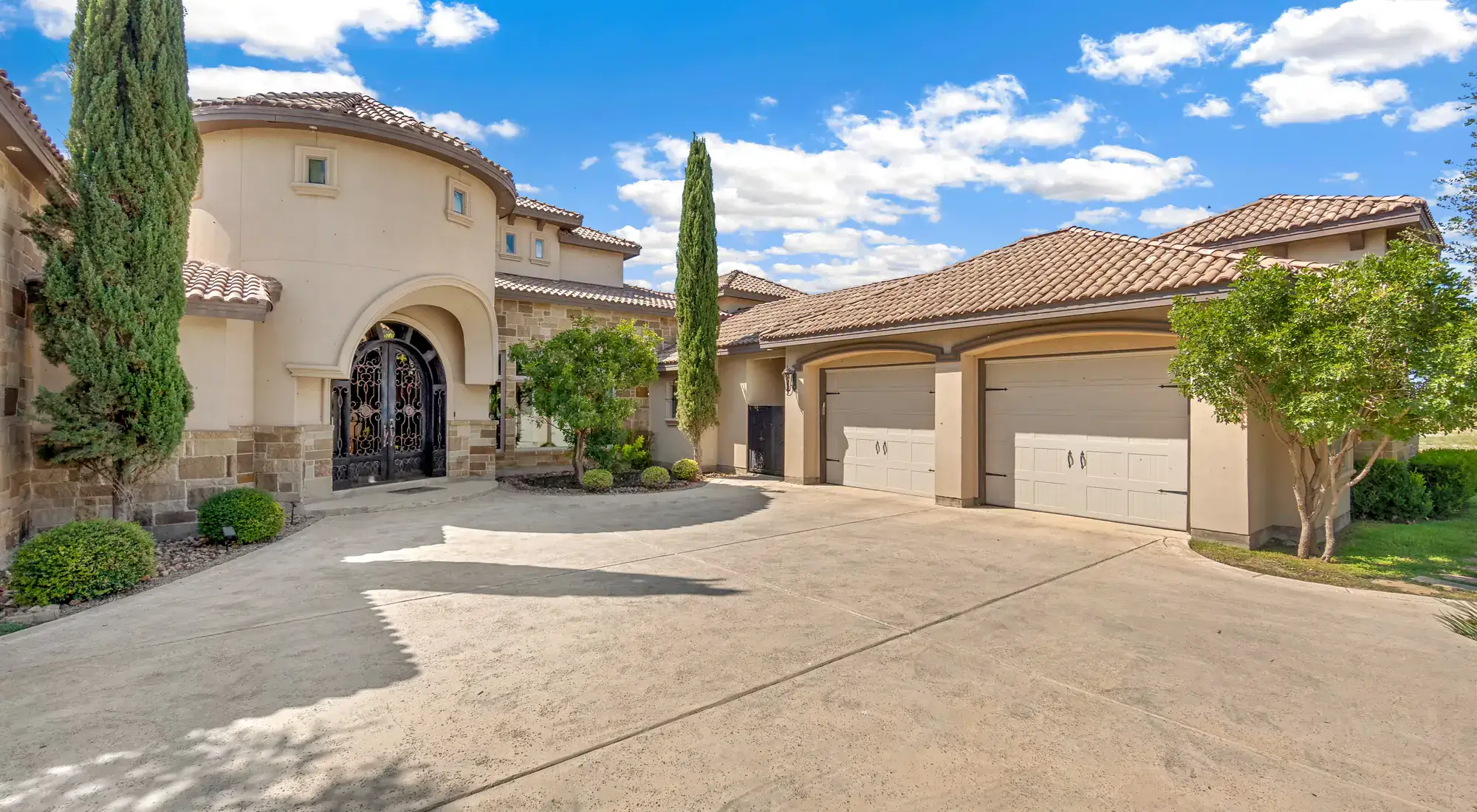 Southwestern-style home with a tile roof