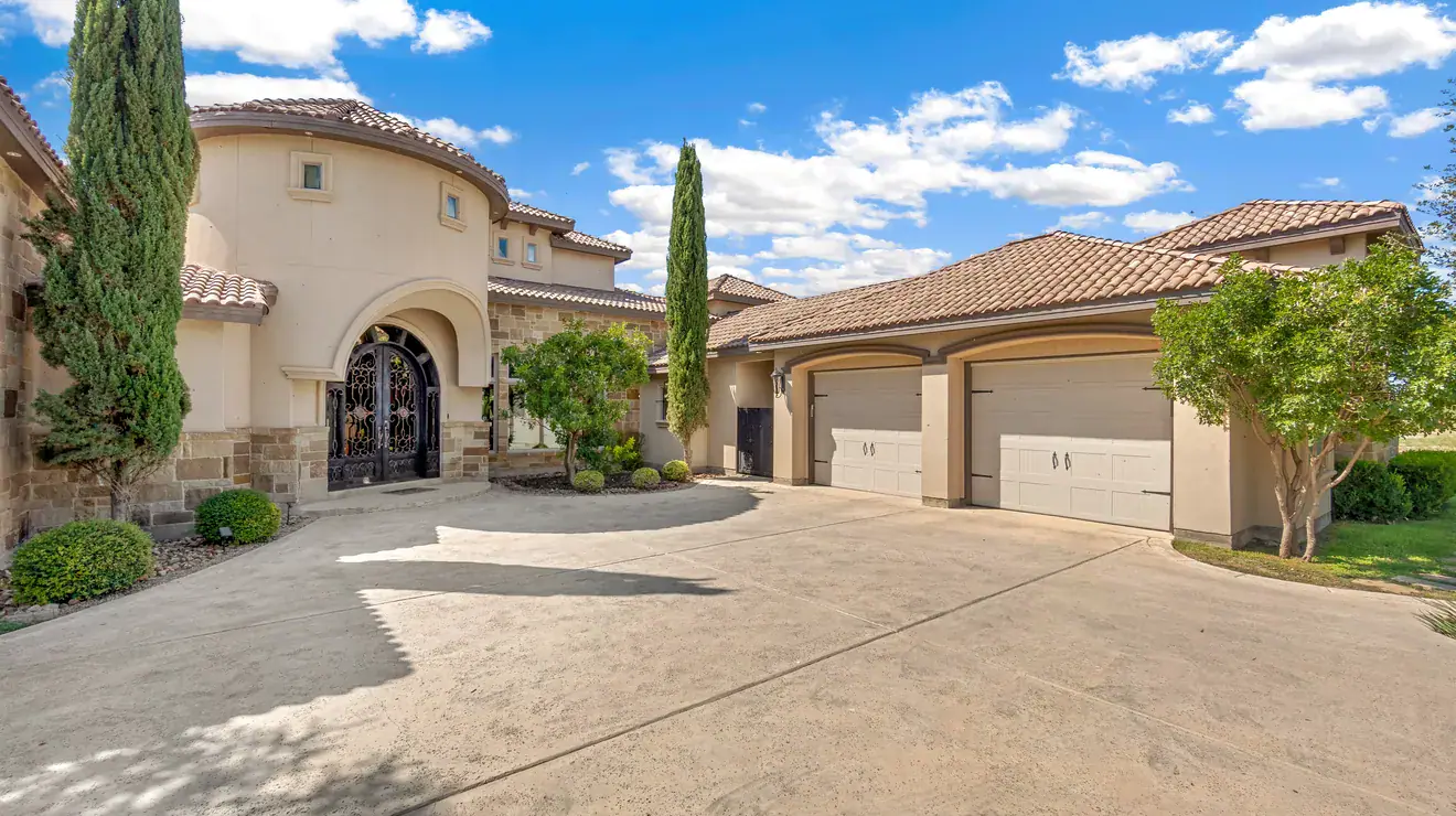 Southwestern-style home with a tile roof