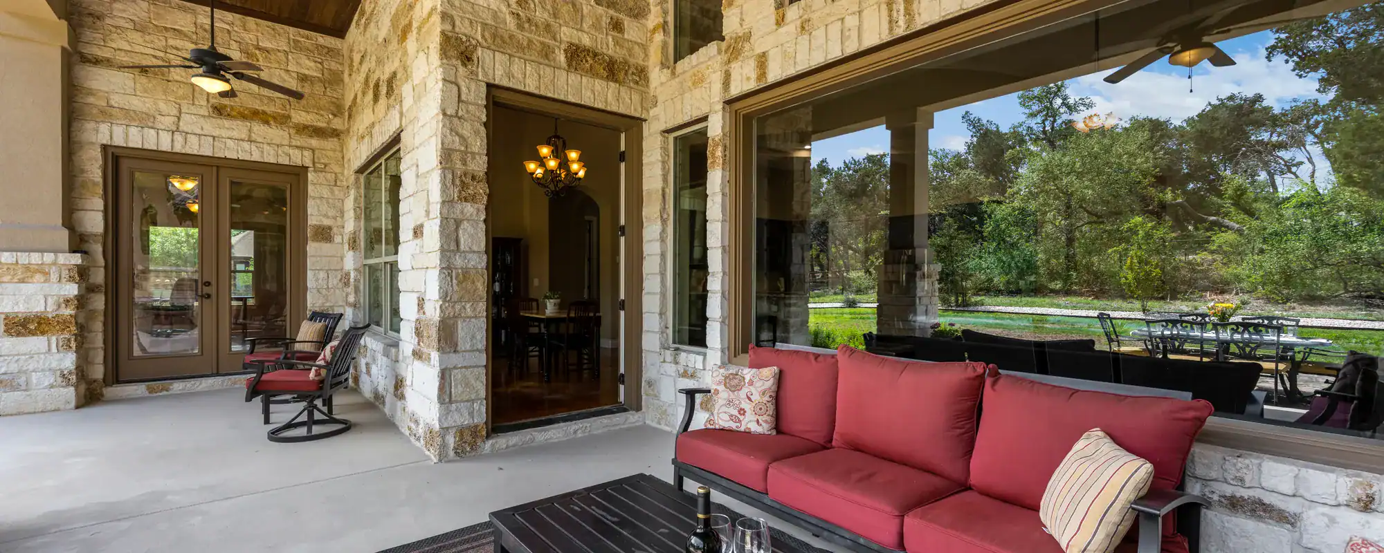 Covered home patio with a sofa
