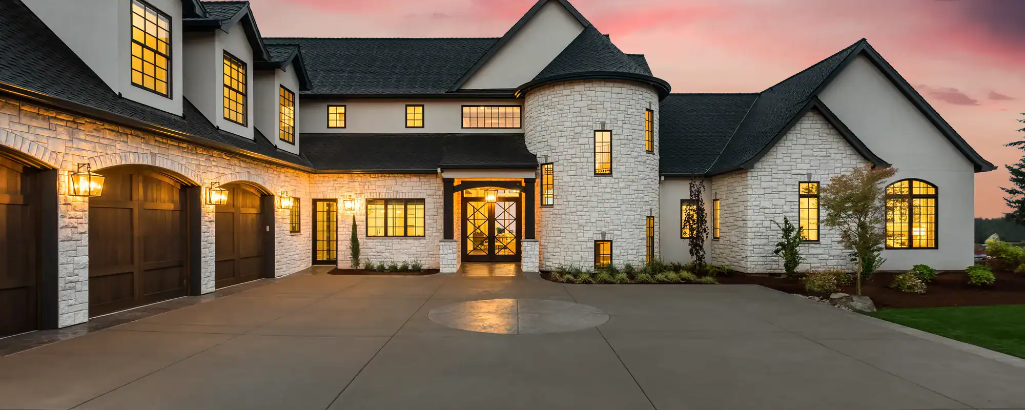 Home exterior and driveway at sunset