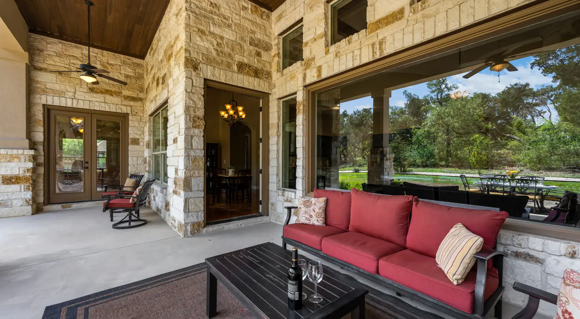 Covered home patio with a sofa