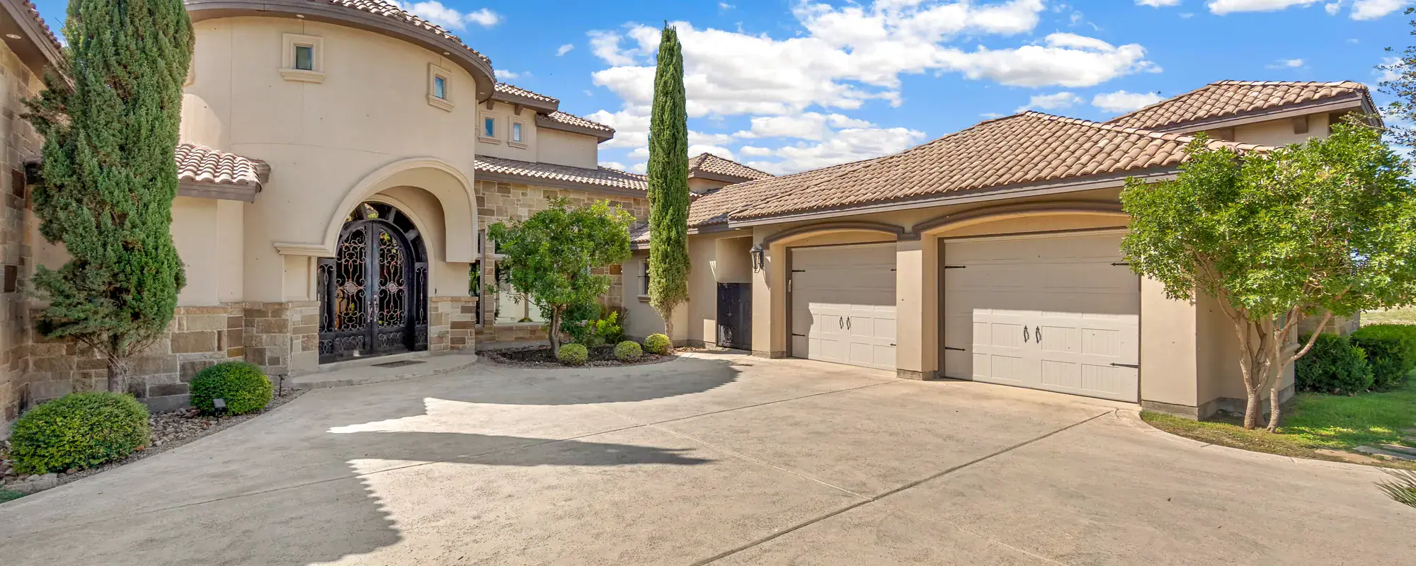 Southwestern-style home with a tile roof