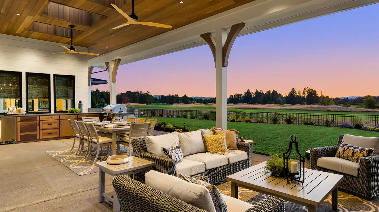 Covered outdoor kitchen and patio at sunset