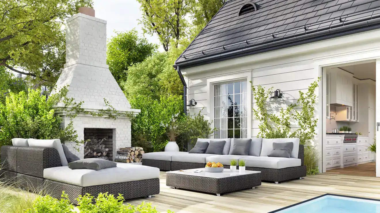 Patio with garden furniture beside a pool