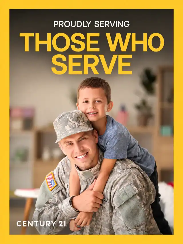 Century 21 poster reading Proudly serving those who serve, showing a smiling soldier giving a child a piggyback ride