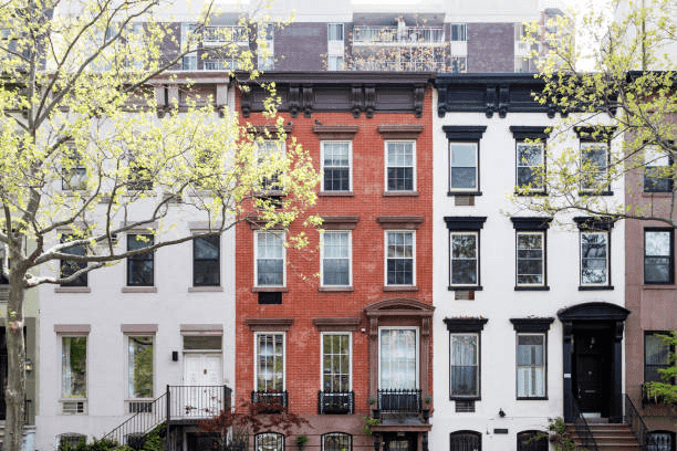 Row of classic New York City brownstone apartment buildings