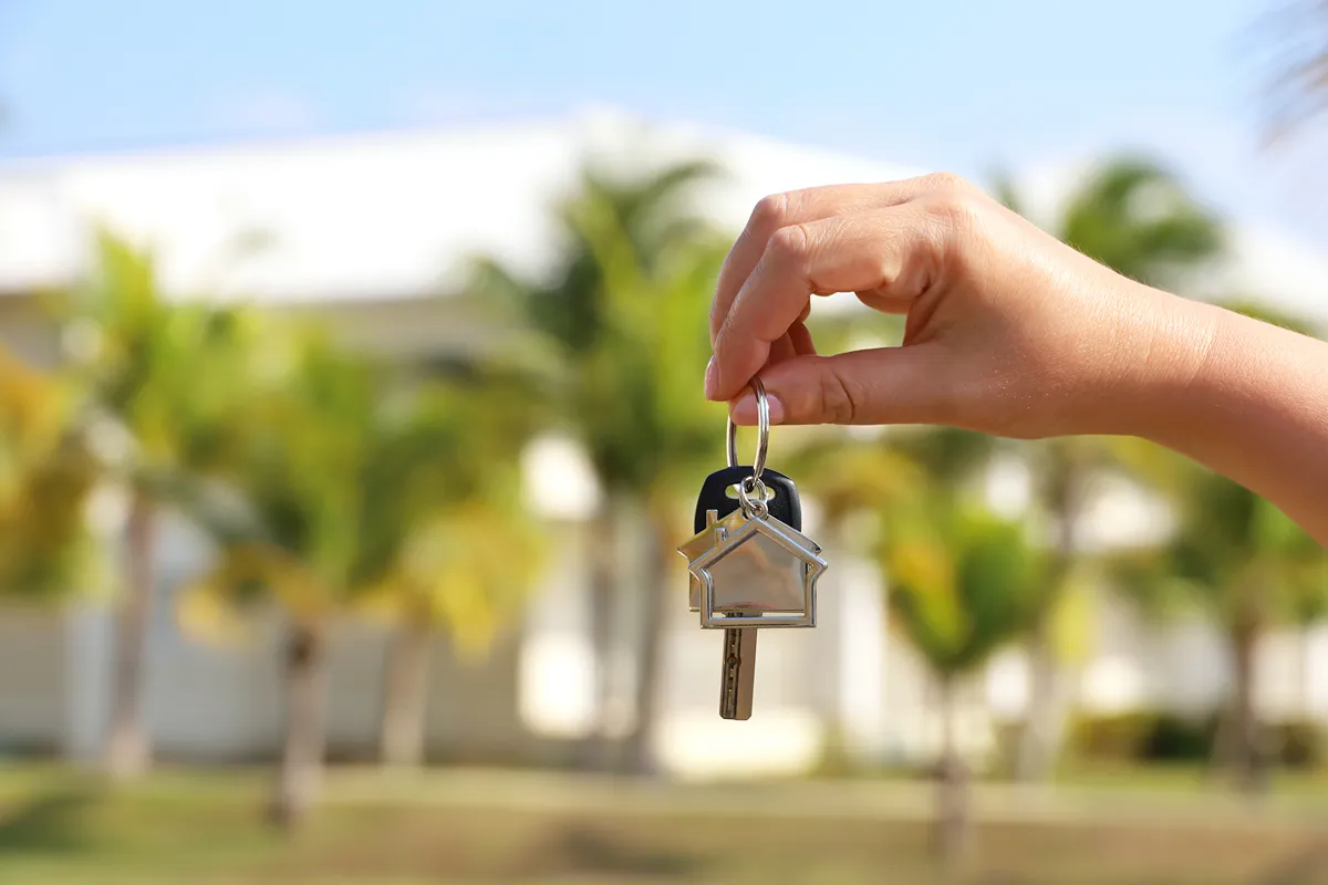 Keys on the floor against a blurred window backdrop
