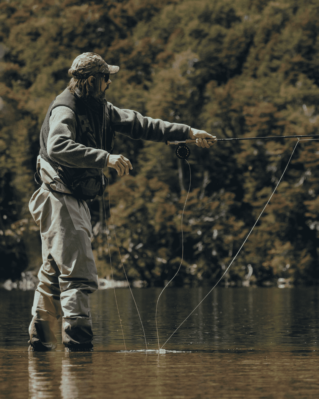 fly fisherman in a blue ridge mountain stream