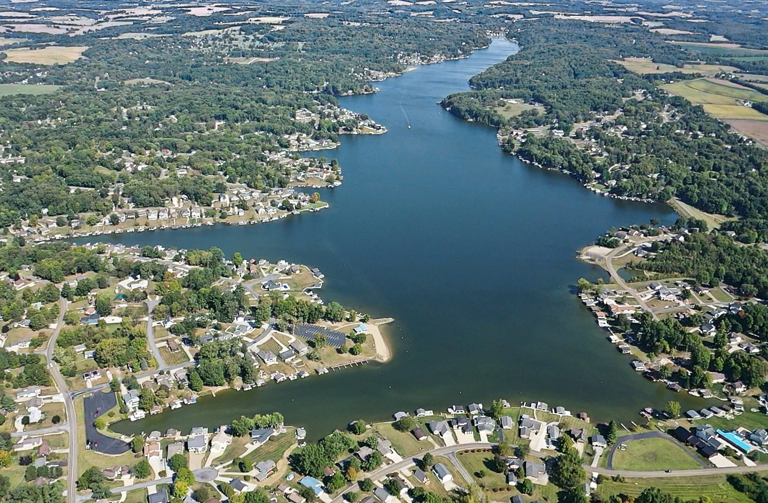 Aerial view of Apple Valley Lake, Ohio, showing lakefront homes, wooded shoreline and varied coves.