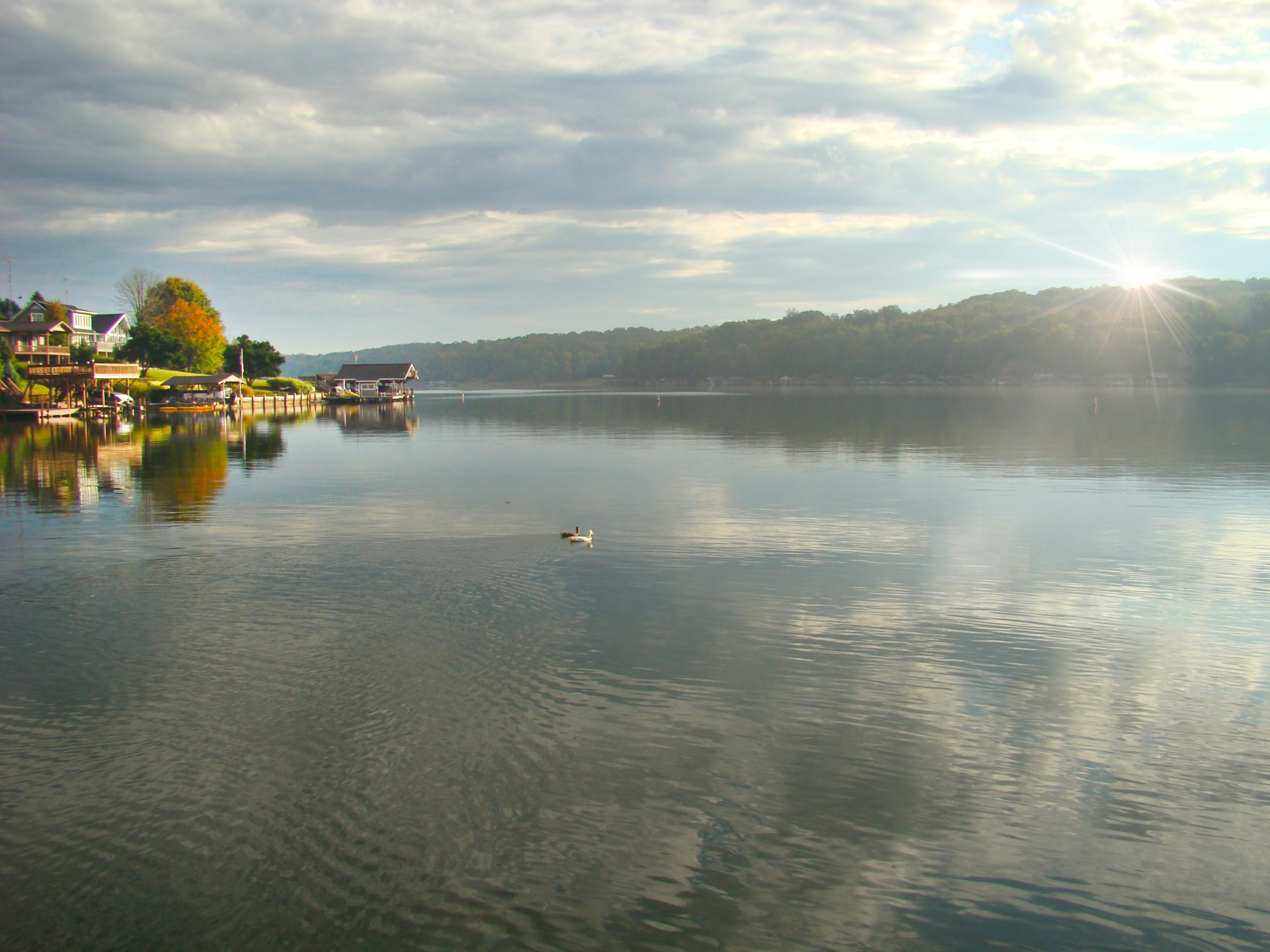 Lakefront homes and docks along Apple Valley Lake, Ohio, in morning light.