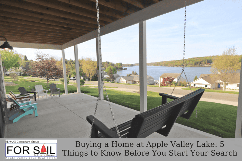 Covered porch with hanging bench swing overlooking Apple Valley Lake and nearby homes, featured in a real estate guide about buying a home at Apple Valley Lake.