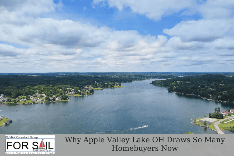Aerial drone view of Apple Valley Lake OH with shoreline homes, blue water, and cloudy sky, featured image for why Apple Valley Lake draws homebuyers now.